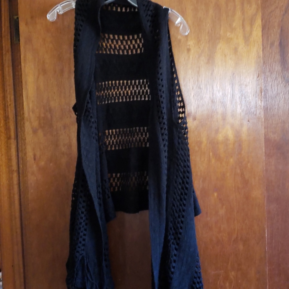 Black crocheted vest with long fringed front.